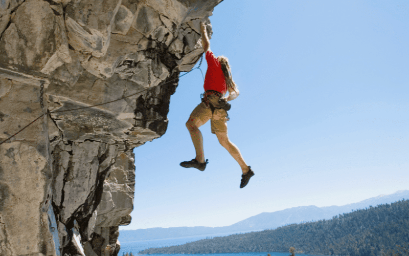 A climber tackles a challenging rock face in Germany, navigating through various climbing techniques and difficulty levels